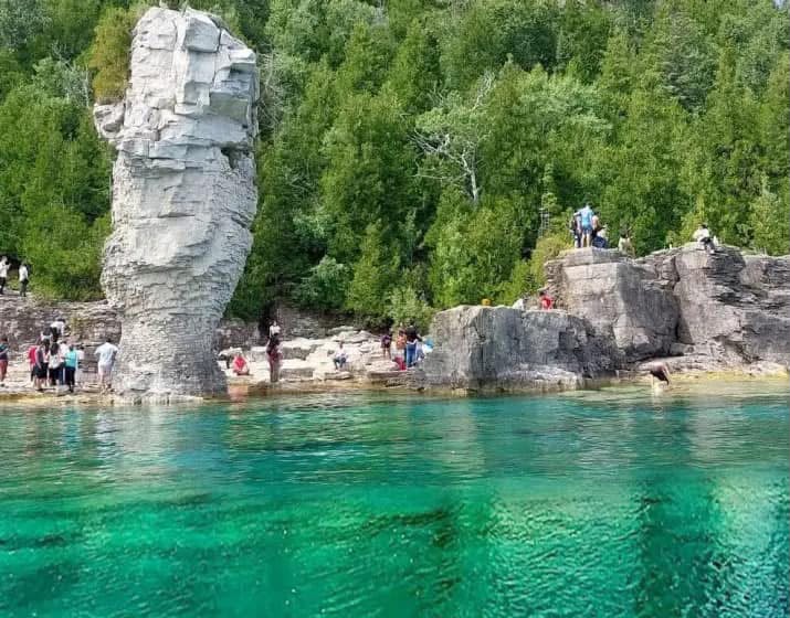 Turquoise Grotto water with tall white limestone rock formation